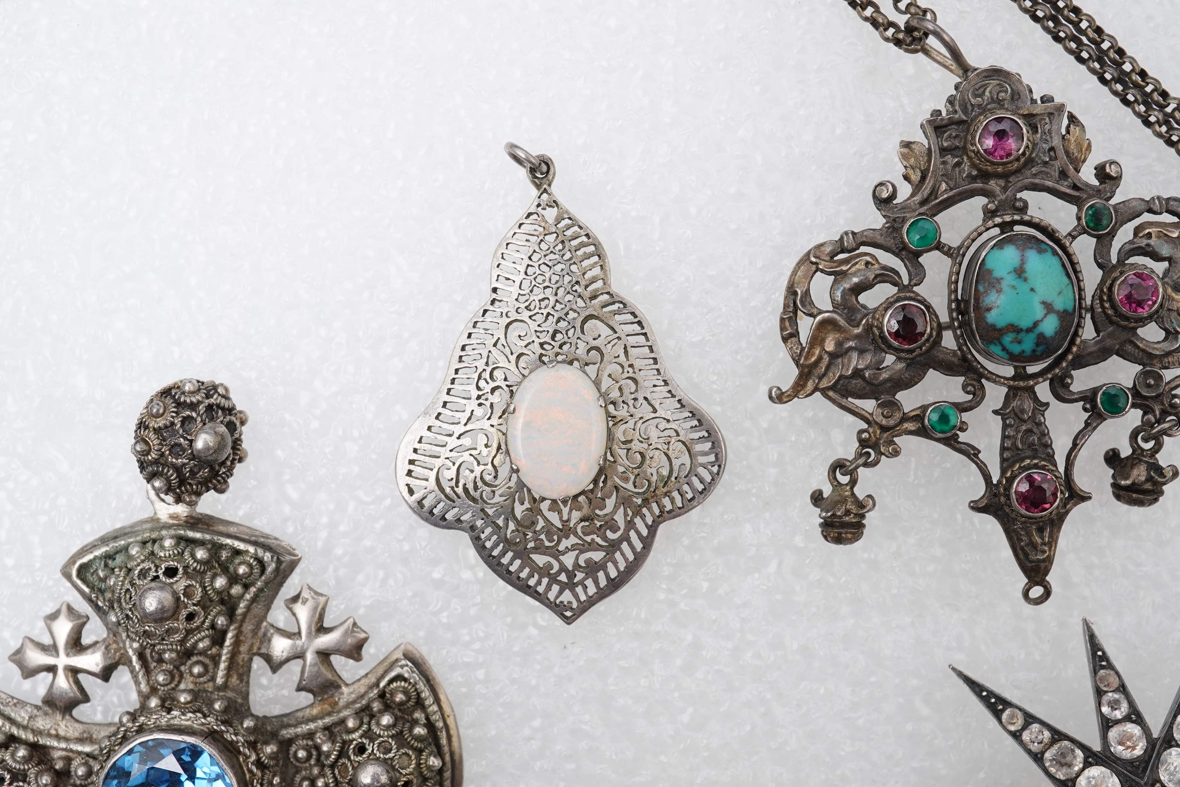 A group of jewels, comprising: a late 19th century and later Renaissance revival-style pendant set with an oval turquoise cabochon, circular-cut garnets and circular-cut green chalcedony, mounted in silver, length 6cm, s